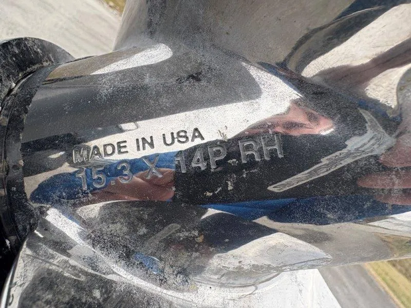 Slide: The Image of Close-up of a Regency 250 DL3 2020 boat propeller, marked "Made in USA 15.3 x 14P RH". - 26