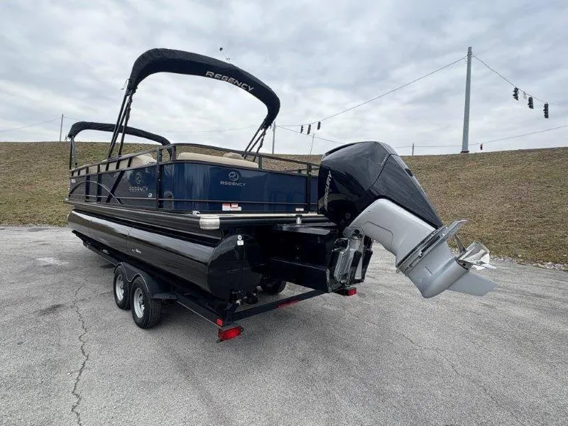 Slide: The Image of 2020 Regency 250 DL3 pontoon boat with outboard motor on a trailer. - 40