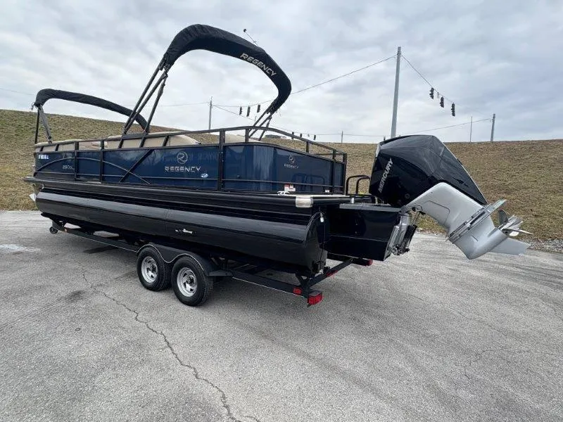 Slide: The Image of 2020 Regency 250 DL3 pontoon boat on trailer, parked outdoors. - 41