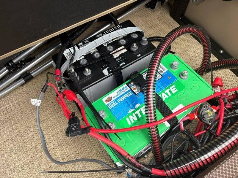 Slide: The Image of Battery setup in a 2020 Regency 250 DL3 with cables and connectors. - 43