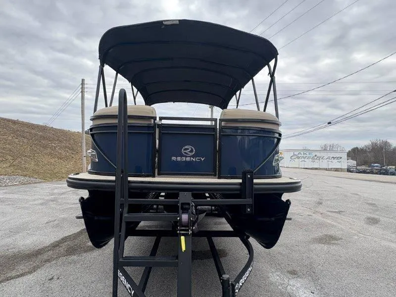 Slide: The Image of 2020 Regency 250 DL3 pontoon boat on trailer, overcast sky background. - 44