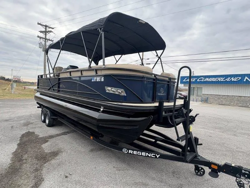 Slide: The Image of 2020 Regency 250 DL3 pontoon boat on trailer, parked near Lake Cumberland. - 48