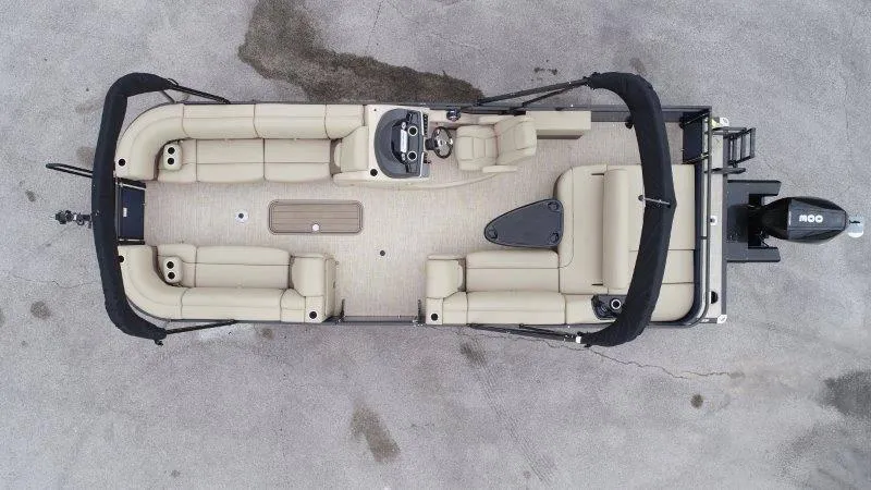 Slide: The Image of Aerial view of 2020 Regency 250 DL3 pontoon boat with beige seating and black canopy. - 8