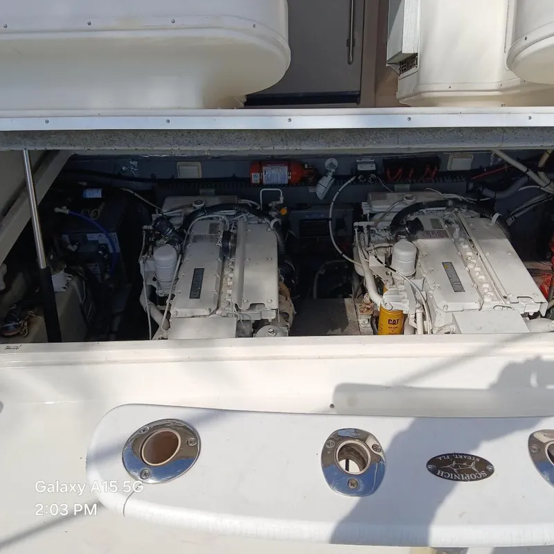 Slide: The Image of Engine compartment of a 2000 Sea Ray Amberjack 340 boat, showcasing dual engines. - 11