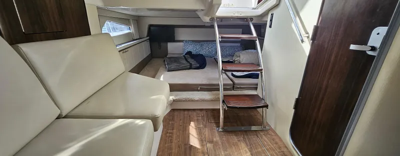 Slide: The Image of Interior of 2018 Regal 33 XO yacht with seating and wooden flooring. - 13