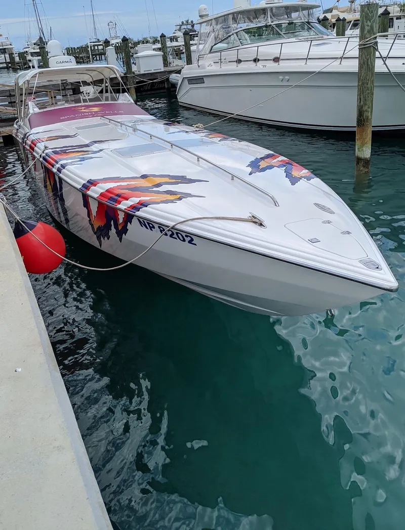 Slide: The Image of 2001 Nor-Tech 500 speedboat docked, featuring vibrant graphics and sleek design. - 1