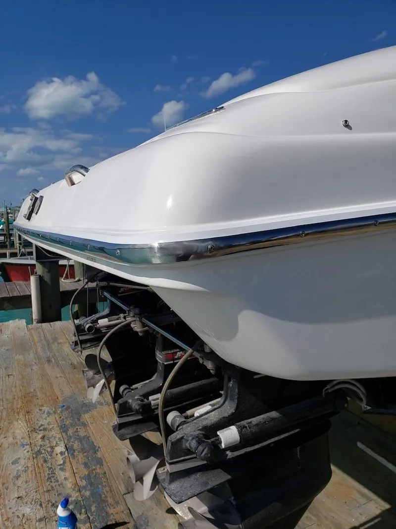 Slide: The Image of 2001 Nor-Tech 500 boat on dock, clear sky background. - 4