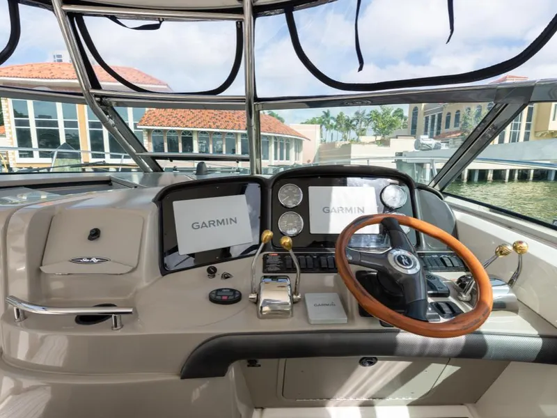 Slide: The Image of Helm of 2005 Sea Ray 390 Sundancer with Garmin navigation displays. - 12