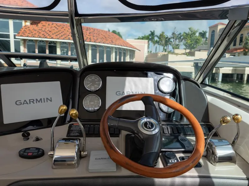 Slide: The Image of Dashboard of a 2005 Sea Ray 390 Sundancer with Garmin navigation system. - 13