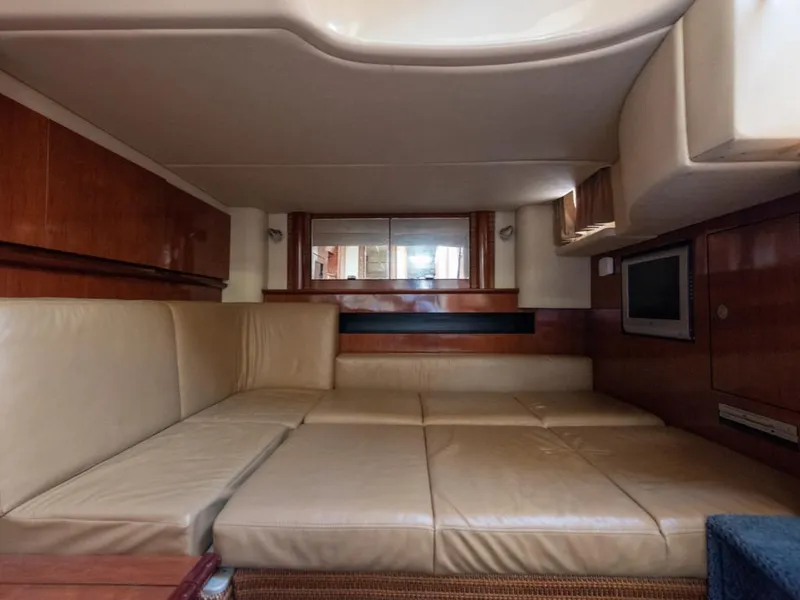 Slide: The Image of Luxurious interior of 2005 Sea Ray 390 Sundancer yacht with beige seating and wood accents. - 18