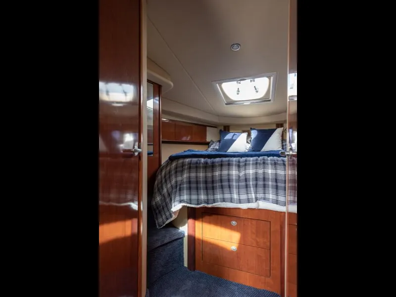 Slide: The Image of Interior cabin of 2005 Sea Ray 390 Sundancer with bed and skylight. - 26
