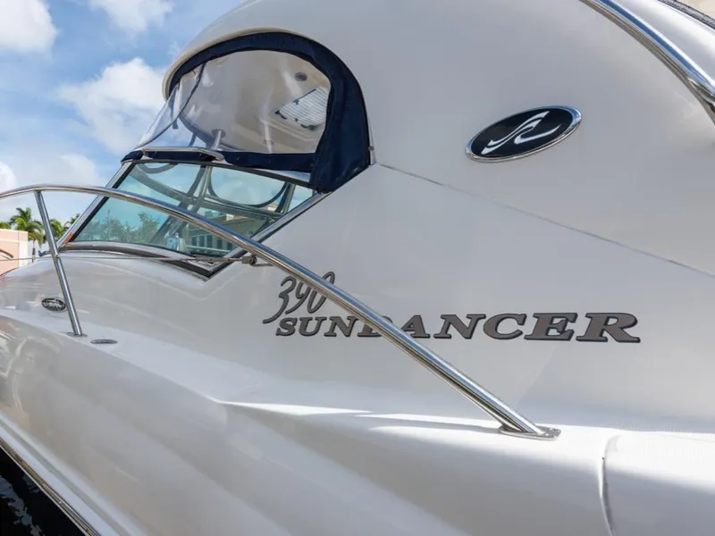 Slide: The Image of 2005 Sea Ray 390 Sundancer yacht with sleek design and elegant branding. - 5