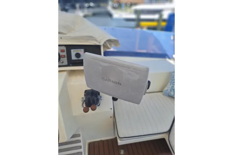 Slide: The Image of Cockpit of 1988 Birchwood 44TS boat with Garmin navigation system. - 12