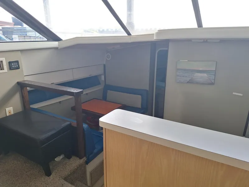 Slide: The Image of Interior of 1992 Silverton 34 Convertible boat with seating and table. - 11