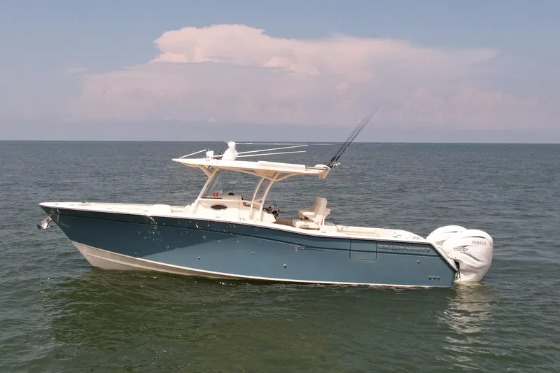 Slide: The Image of 2019 Grady-White Canyon 336 boat on open water, side view. - 1