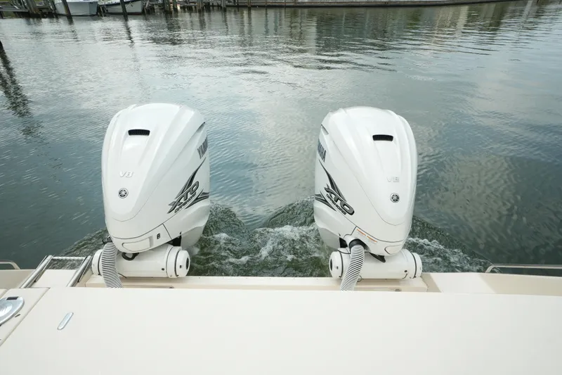 Slide: The Image of 2019 Grady-White Canyon 336 boat with twin outboard engines on calm water. - 10