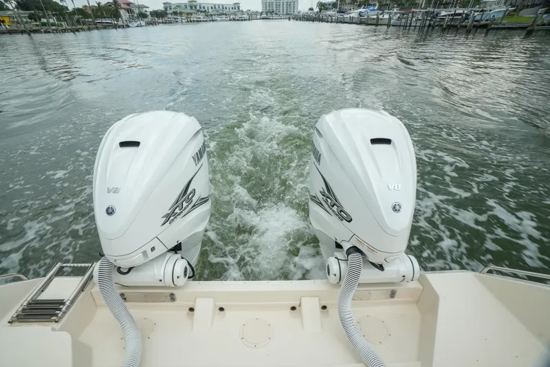Slide: The Image of 2019 Grady-White Canyon 336 with twin Yamaha outboard engines on water. - 14