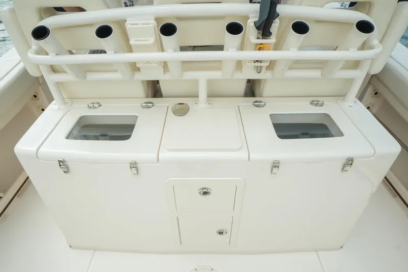 Slide: The Image of 2019 Grady-White Canyon 336 fishing rod holders and storage compartments. - 19