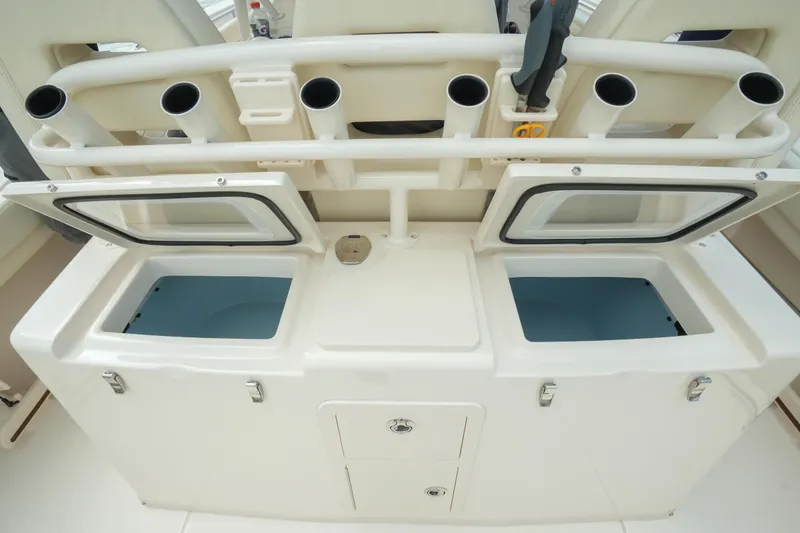 Slide: The Image of 2019 Grady-White Canyon 336 fishing station with open storage compartments and rod holders. - 20