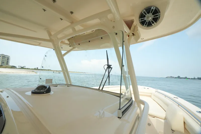 Slide: The Image of 2019 Grady-White Canyon 336 boat interior with ocean view and clear skies. - 25
