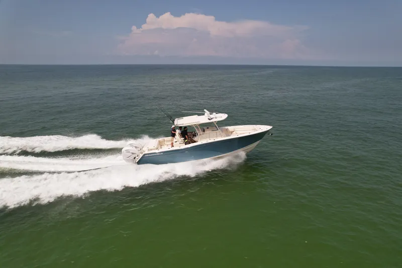 Slide: The Image of 2019 Grady-White Canyon 336 boat cruising on open water. - 3