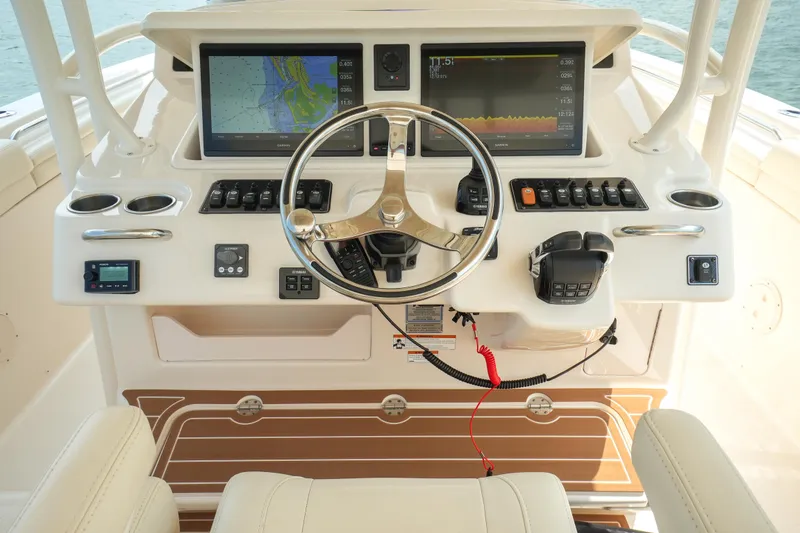Slide: The Image of 2019 Grady-White Canyon 336 helm with dual displays and steering wheel. - 30