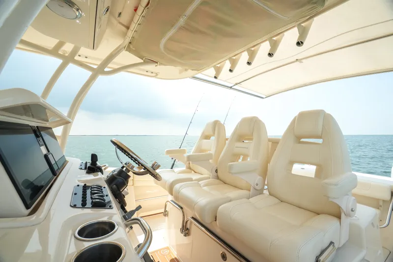 Slide: The Image of 2019 Grady-White Canyon 336 boat interior with luxurious seating and ocean view. - 32