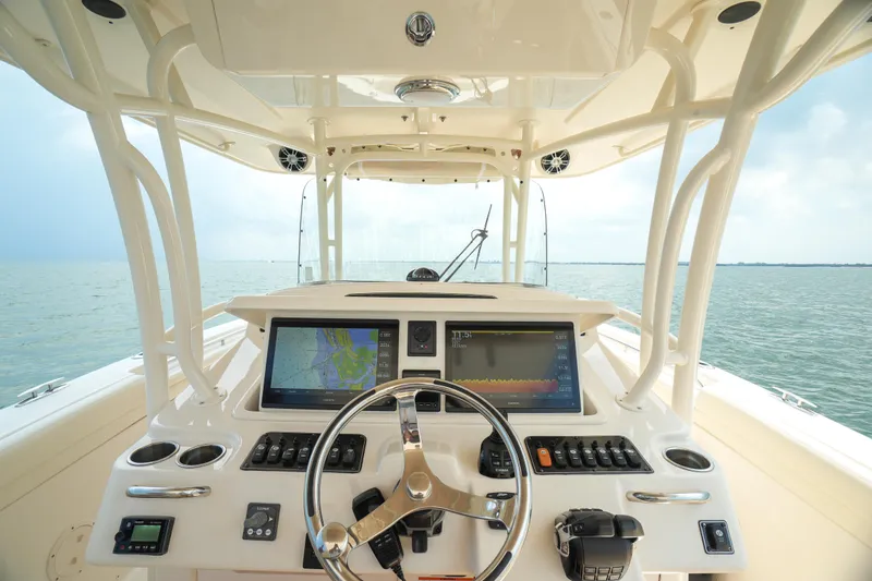 Slide: The Image of 2019 Grady-White Canyon 336 helm with dual displays on open water. - 36