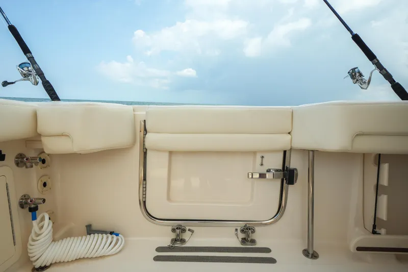 Slide: The Image of 2019 Grady-White Canyon 336 boat interior with fishing rods and equipment. - 37