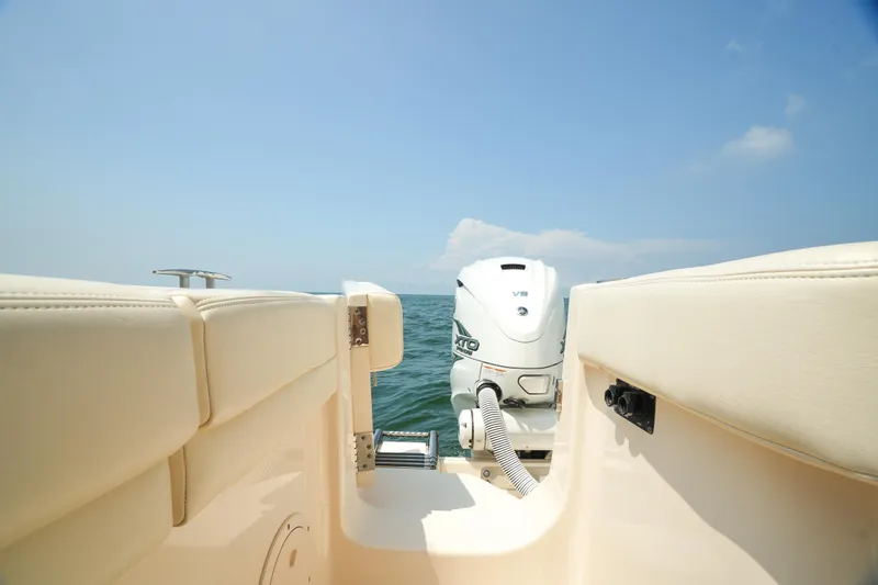 Slide: The Image of 2019 Grady-White Canyon 336 boat with outboard motor on open water. - 38