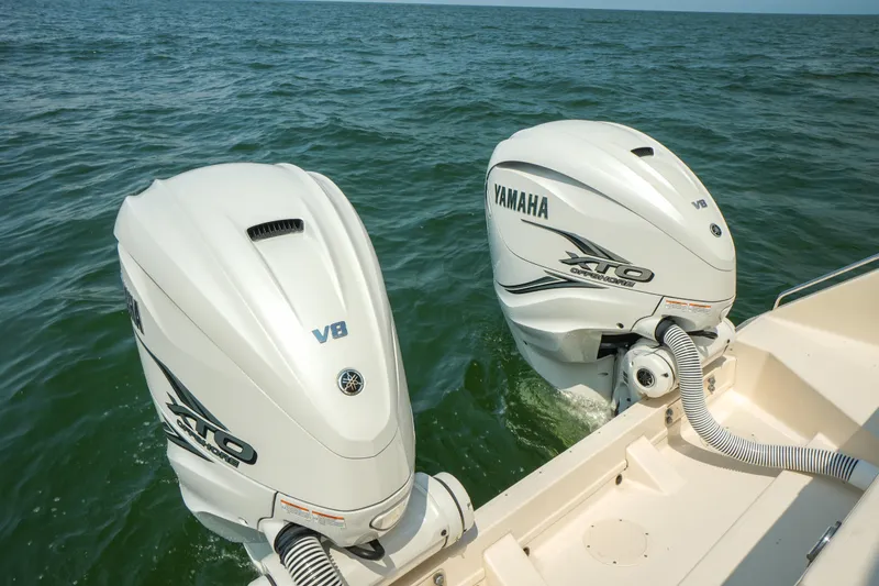 Slide: The Image of 2019 Grady-White Canyon 336 with twin Yamaha V8 outboard engines on open water. - 39