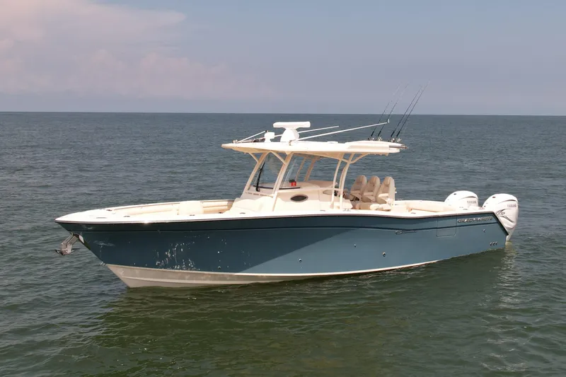 Slide: The Image of 2019 Grady-White Canyon 336 boat on calm ocean waters. - 4