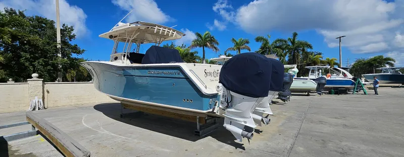 Slide: The Image of 2019 Grady-White Canyon 336 boat docked under clear blue sky. - 44