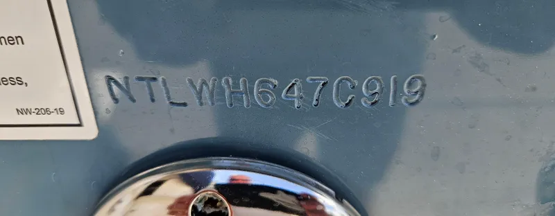 Slide: The Image of 2019 Grady-White Canyon 336 hull identification number, NTLWH647C919, embossed on blue surface. - 47