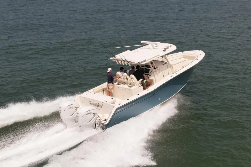 Slide: The Image of 2019 Grady-White Canyon 336 boat cruising on open water. - 5