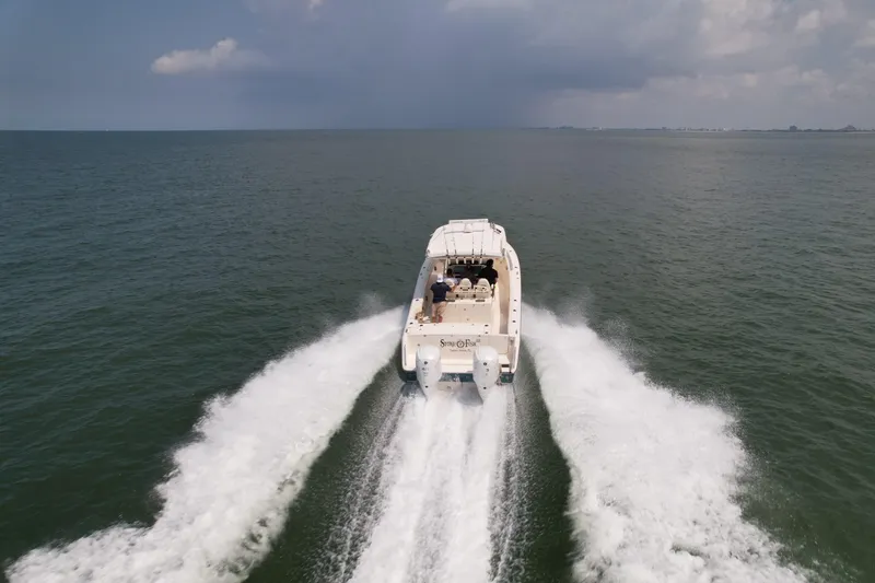 Slide: The Image of Grady-White Canyon 336 boat cruising on open water, 2019 model. - 6