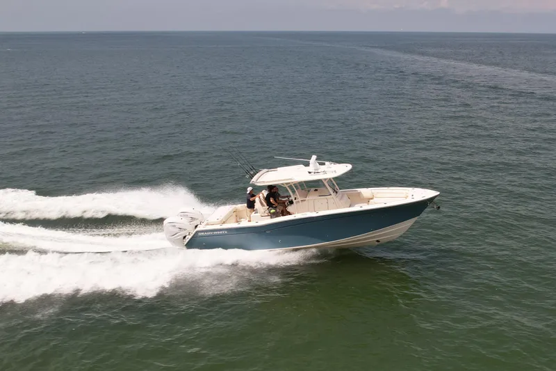 Slide: The Image of 2019 Grady-White Canyon 336 boat cruising on open water. - 7
