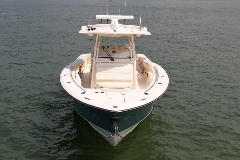 Slide: The Image of 2019 Grady-White Canyon 336 boat on calm water, front view. - 9