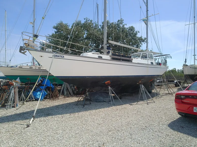 Slide: The Image of 1971 Morgan 40 Cruising Ketch sailboat on stands in a boatyard. - 1