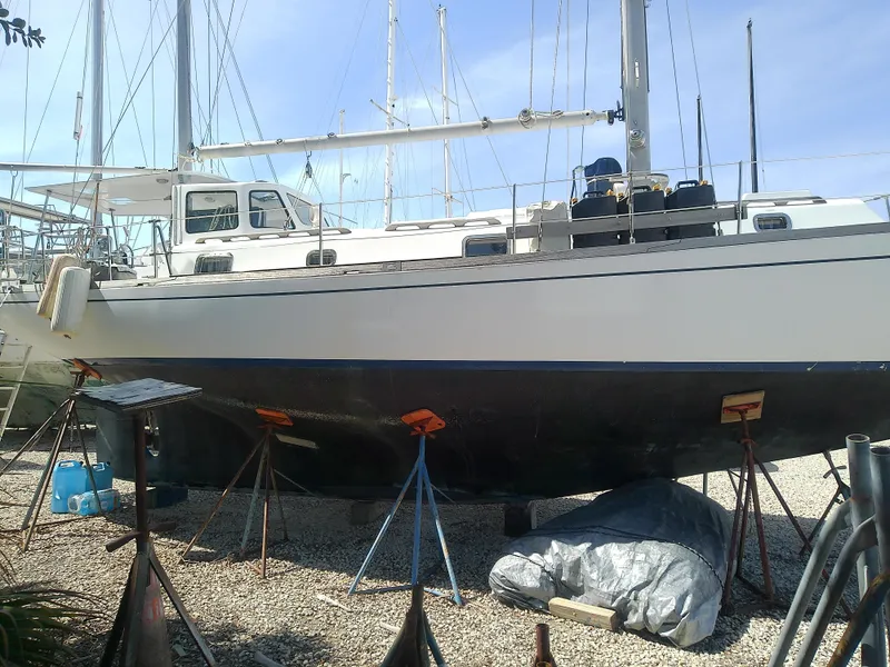 Slide: The Image of 1971 Morgan 40 Cruising Ketch sailboat on dry dock, supported by stands. - 10