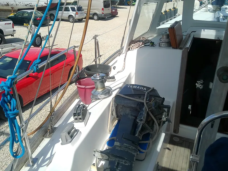 Slide: The Image of 1971 Morgan 40 Cruising Ketch deck with Yamaha engine and nautical equipment. - 12
