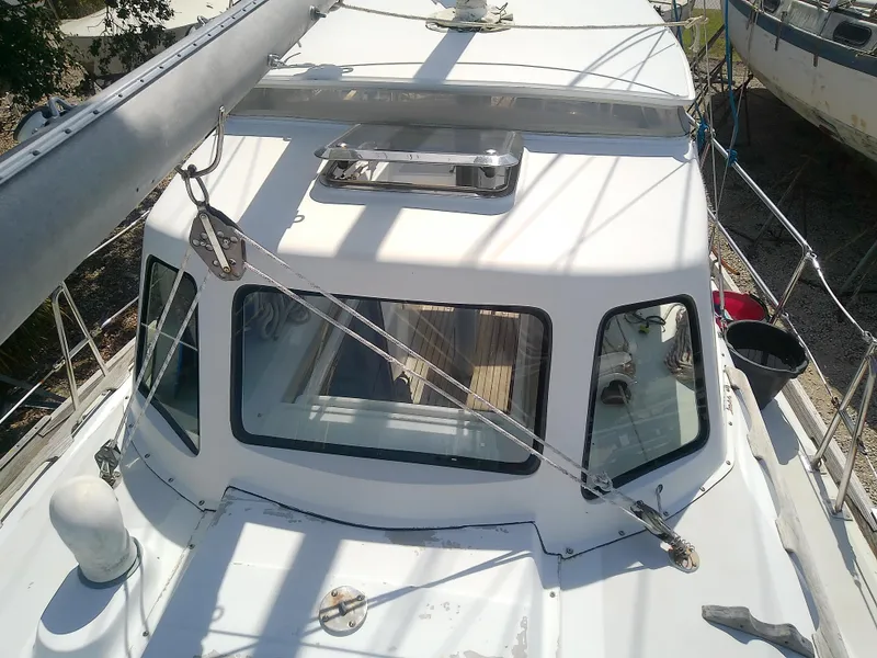 Slide: The Image of 1971 Morgan 40 Cruising Ketch sailboat, deck view with rigging and cabin details. - 22