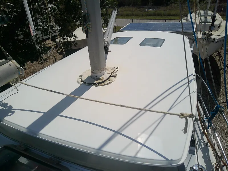 Slide: The Image of 1971 Morgan 40 Cruising Ketch deck with mast and rigging, featuring two hatches. - 24