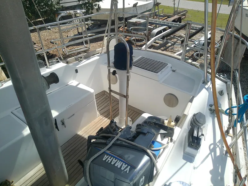 Slide: The Image of 1971 Morgan 40 Cruising Ketch cockpit with Yamaha engine, docked outdoors. - 25