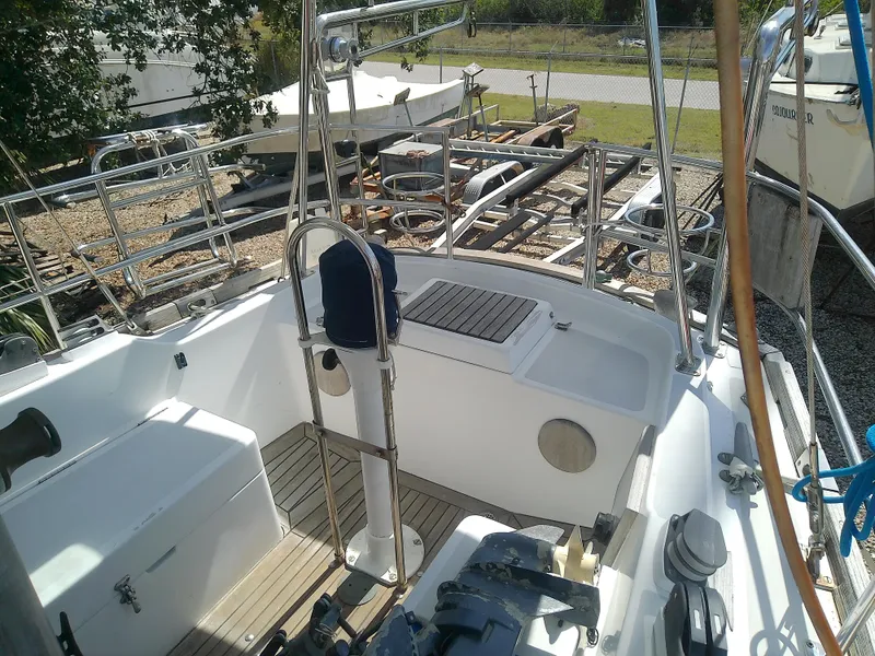 Slide: The Image of 1971 Morgan 40 Cruising Ketch cockpit with wooden deck and nautical equipment. - 26