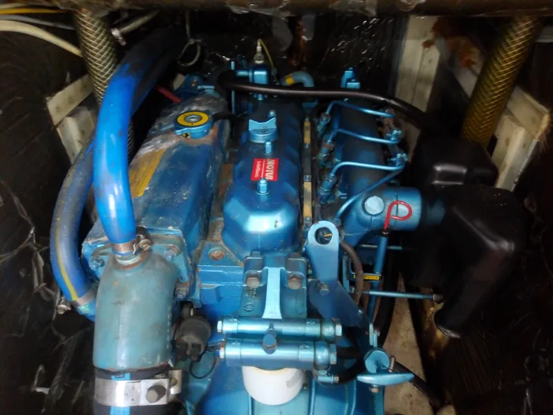 Slide: The Image of Engine of 1971 Morgan 40 Cruising Ketch, showcasing blue components and intricate details. - 33