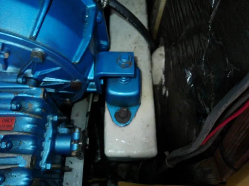 Slide: The Image of Engine component of a 1971 Morgan 40 Cruising Ketch, featuring blue metal parts. - 35