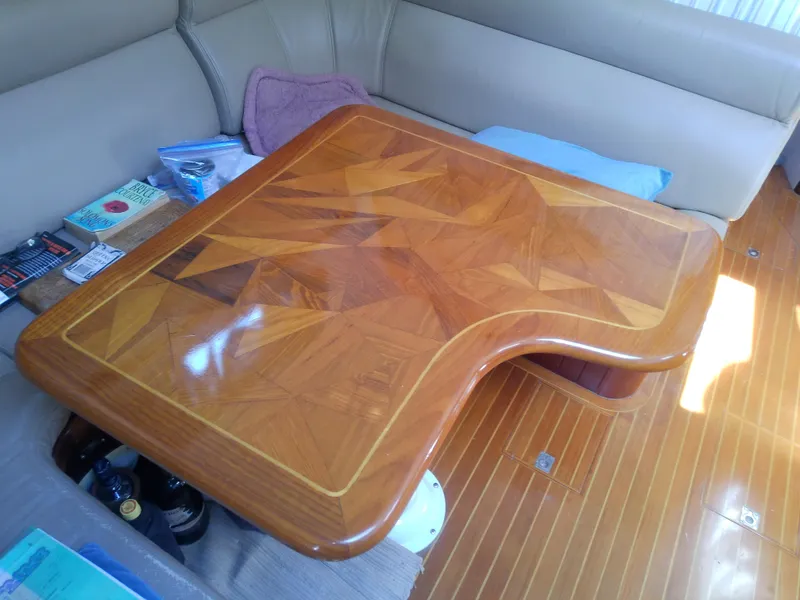 Slide: The Image of 1971 Morgan 40 Cruising Ketch interior with polished wooden table and seating area. - 37