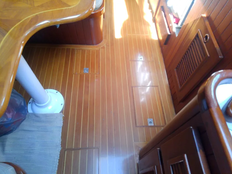 Slide: The Image of Interior of 1971 Morgan 40 Cruising Ketch with polished wooden flooring. - 38