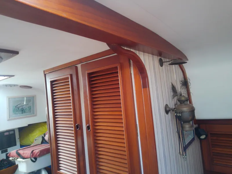 Slide: The Image of Interior of a 1971 Morgan 40 Cruising Ketch with wooden cabinetry and nautical decor. - 42